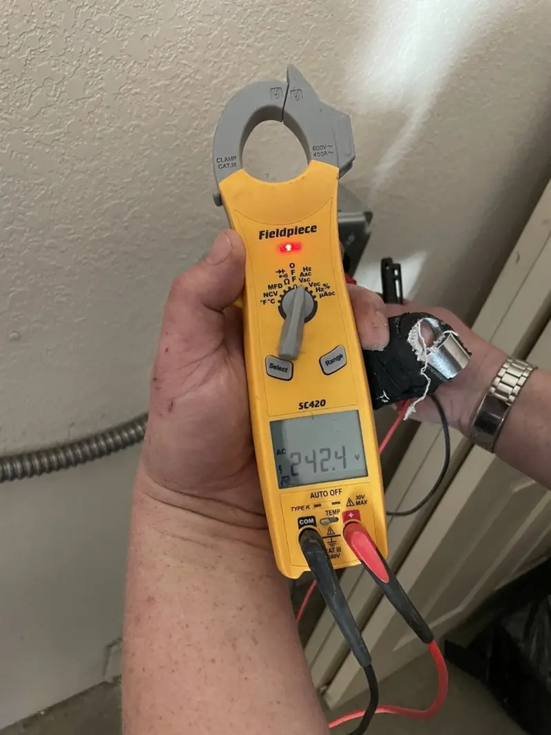 Voltage testing with clamp meter during Whole House Surge Protector in Hanover